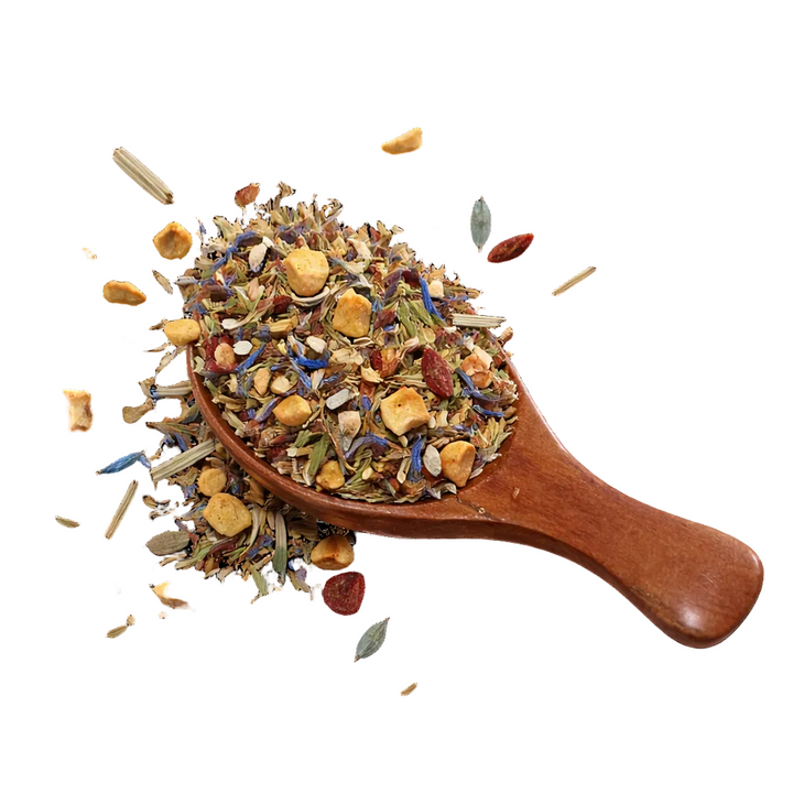 Wooden spoon filled with the Daybreak tea blend on a white background