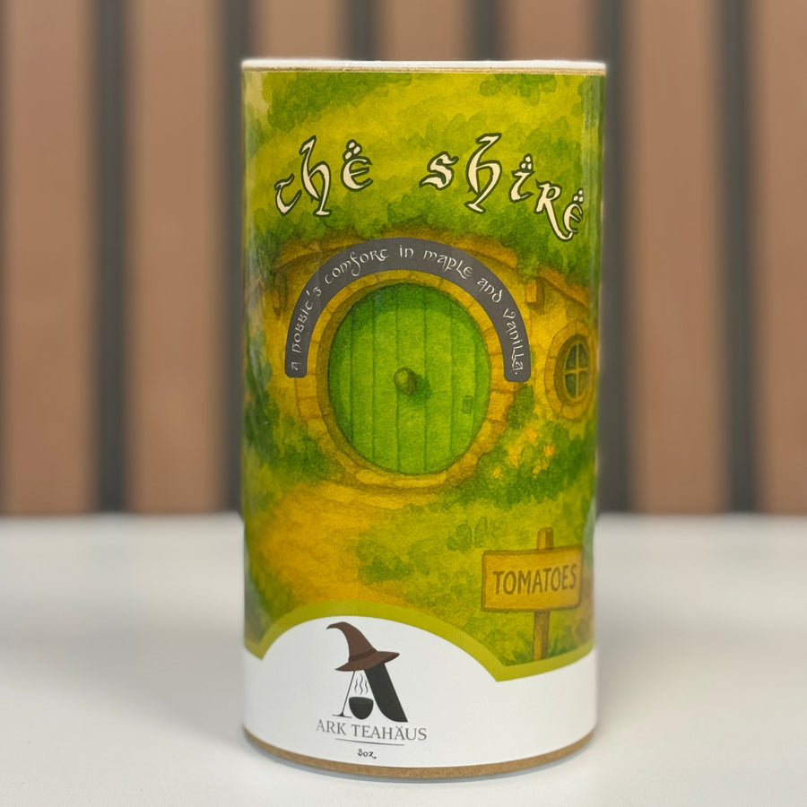 Tea canister with 'The Shire' design and 'Ark Teahaus' branding on a neutral background